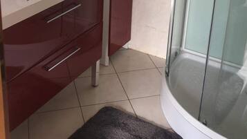 Shower, hair dryer, towels, toilet paper