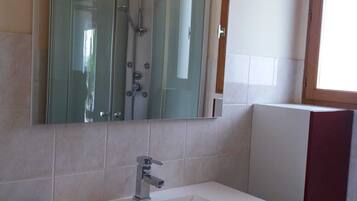 Shower, hair dryer, towels, toilet paper
