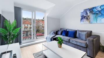 Departamento | Área de sala de estar | Smart TV de 42 pulgadas con canales vía satélite, televisión y Netflix