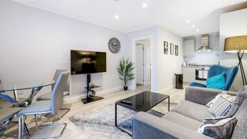 Standard Apartment | Living area | 42-inch Smart TV with satellite channels, TV, Netflix