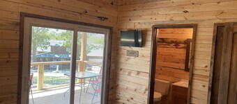 Lake view 2 bedroom cabin that sleeps 6. Private deck and fire pit area.