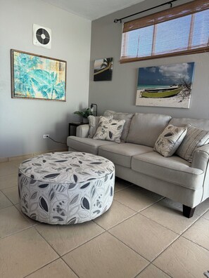 Condo, 1 Bedroom, Ocean View | Living area | 65-inch Smart TV with cable channels, TV - Aguada Beach Condos (Aguada)