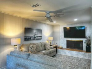 Smart TV, fireplace, books
