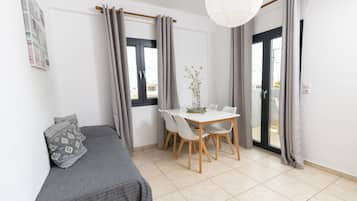 Classic Quadruple Room, 1 Bedroom | Living area | 32-inch TV with digital channels, toys, books
