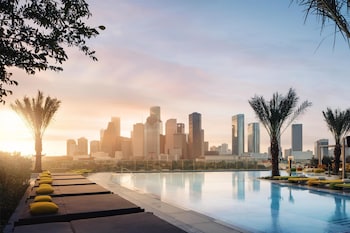 Outdoor pool, cabanas (surcharge), pool umbrellas at Thompson Houston, by Hyatt