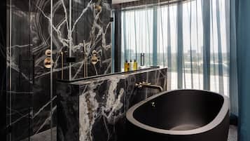 Designer toiletries, hair dryer, bathrobes, slippers