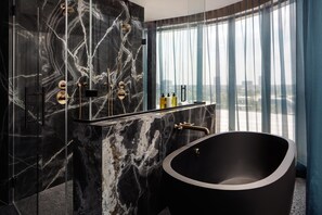 Designer toiletries, hair dryer, bathrobes, slippers