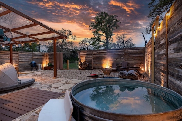 Private hot/cold plunge pool + spa yard at sunset. Fully fenced and completely yours.