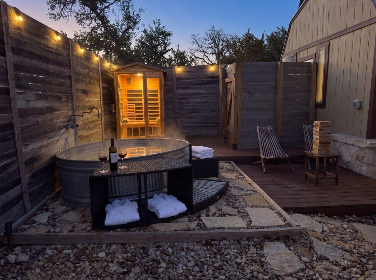 An outdoor hot tub area with seating and a wooden deck.
