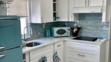 Fridge, microwave, stovetop, coffee/tea maker