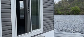 Waterfront Glamping Escape — Cozy Floating Cottages on the Peaceful Beaver River