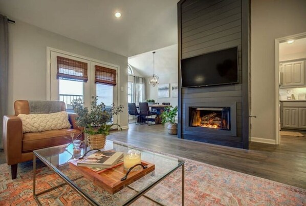 Smart TV, fireplace, table football, books