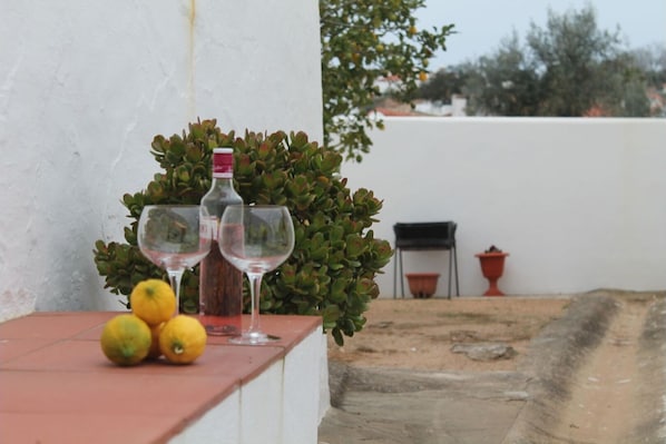 Relax with a glass of wine and a view of the surrounding neighborhood from this charming outdoor space.