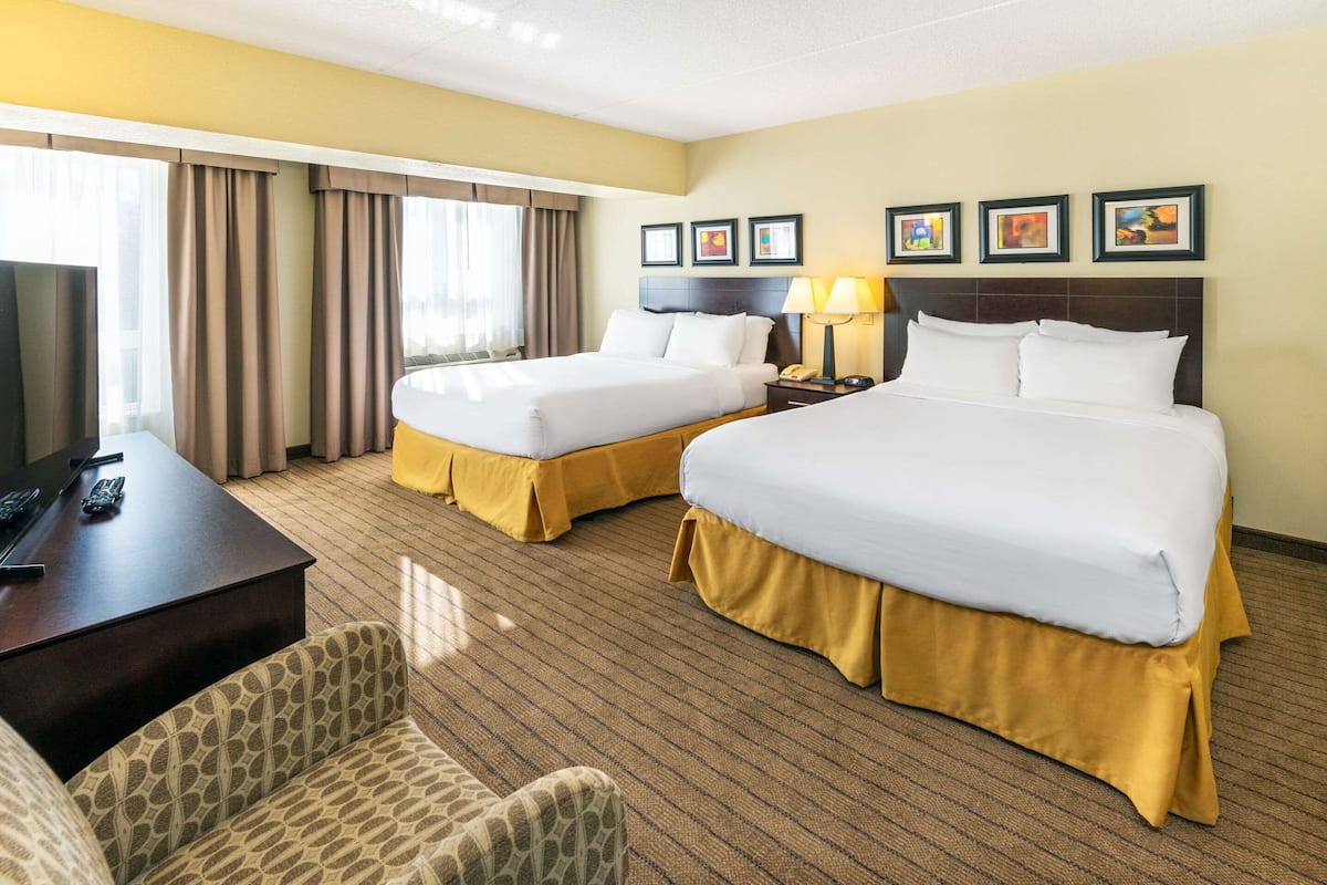 Suite, Multiple Beds, Non Smoking | Desk, laptop workspace, blackout drapes, iron/ironing board