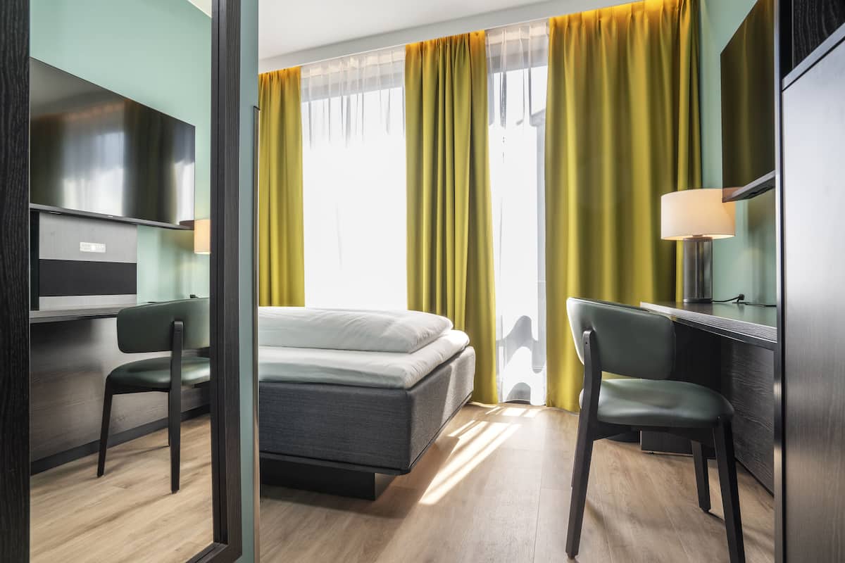 Desk, laptop workspace, free WiFi, bed sheets