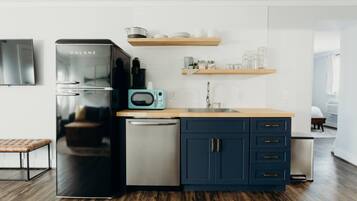 Fridge, coffee/tea maker, cookware/dishes/utensils