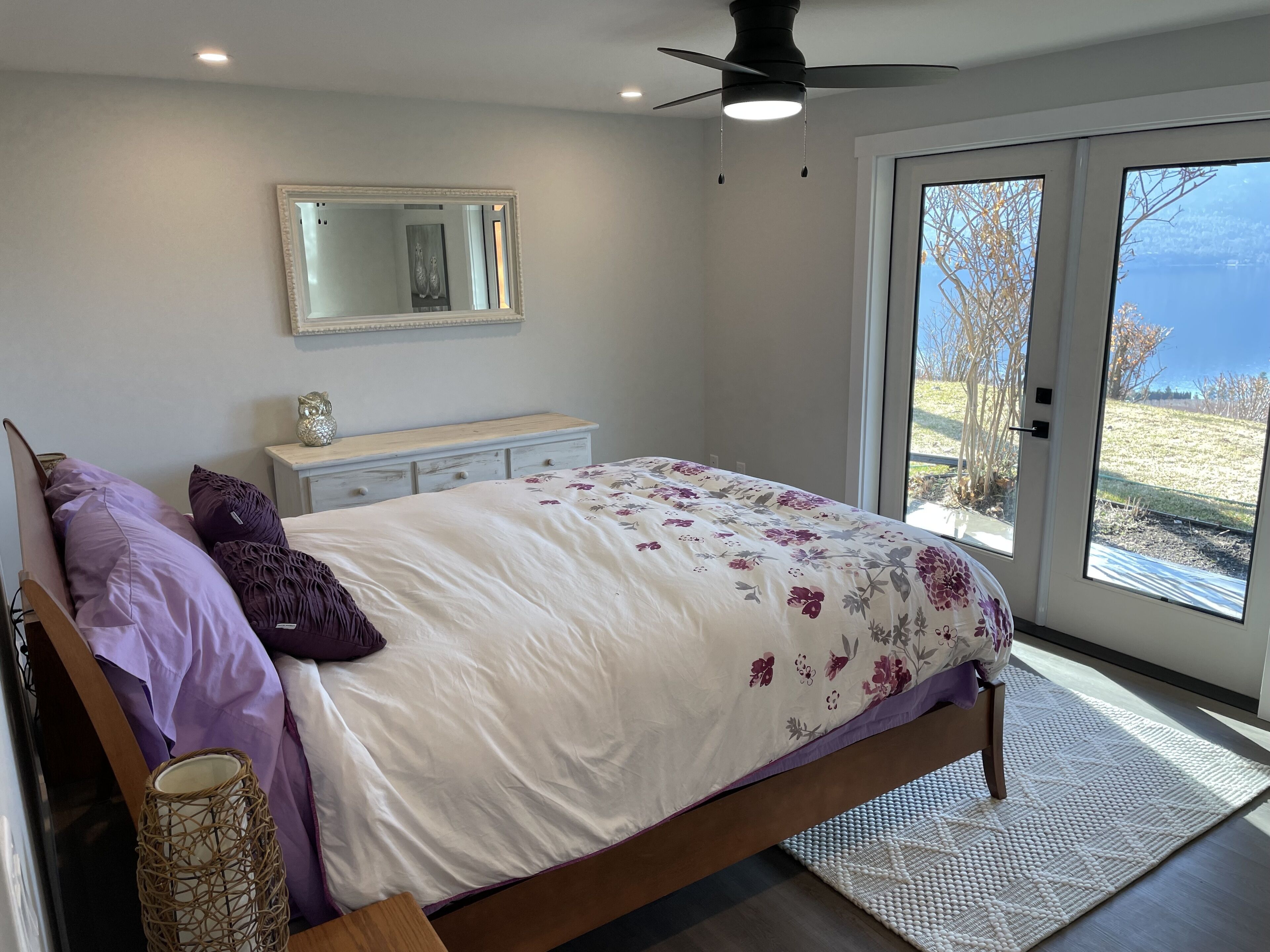 Enjoy the view of Okanagan Lake while relaxing on this private two acres of land