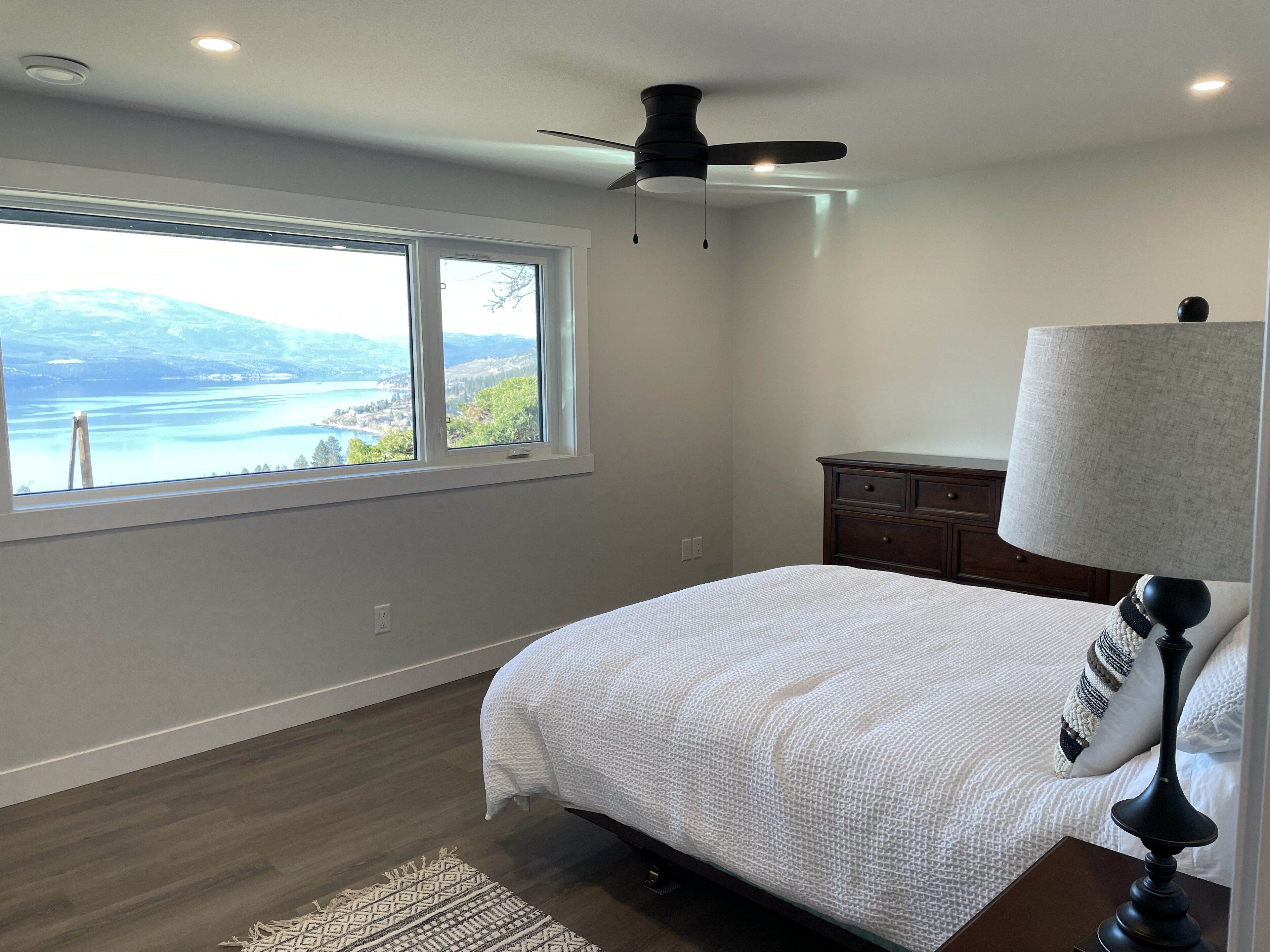 Enjoy the view of Okanagan Lake while relaxing on this private two acres of land