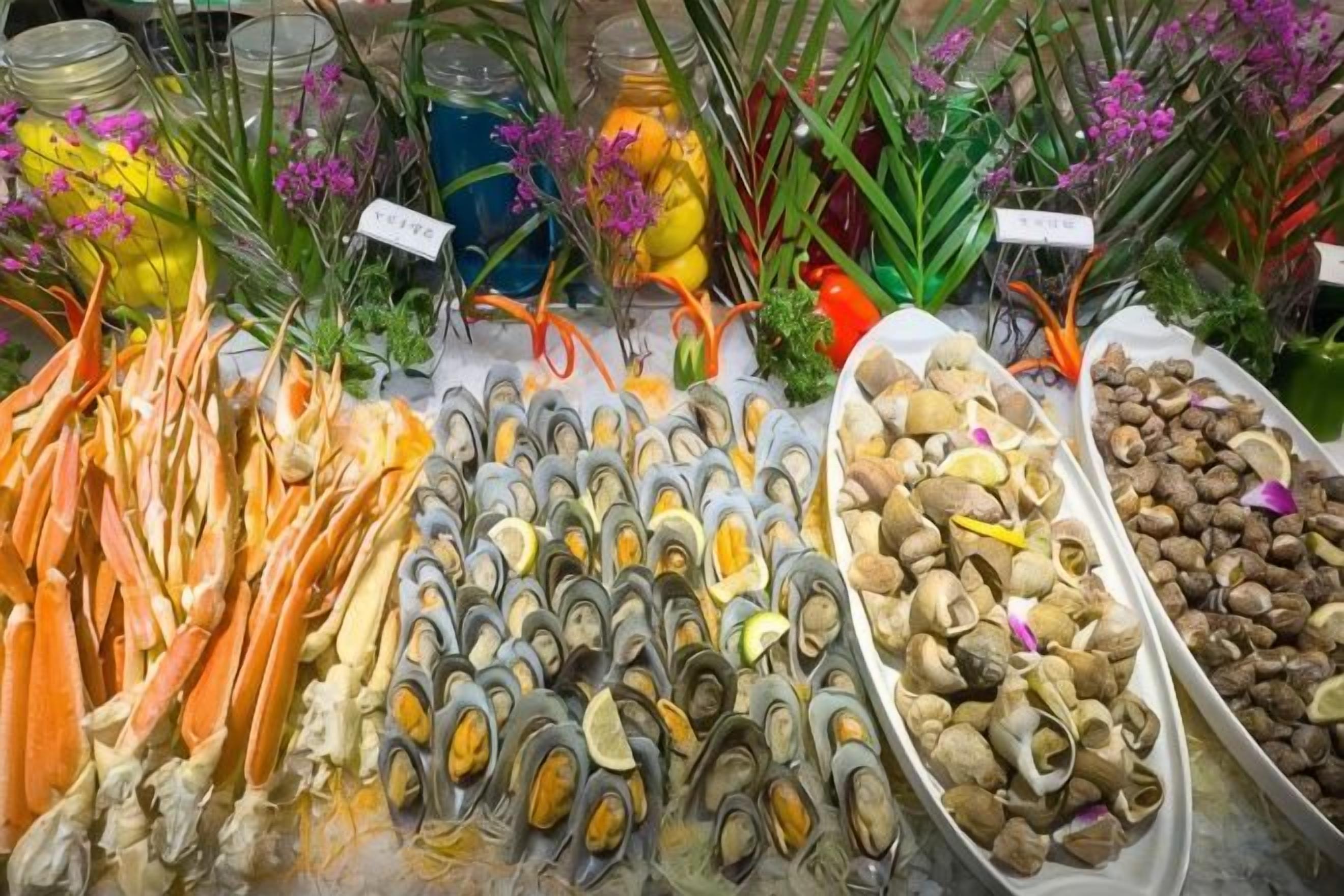 A seafood display with various types of shellfish and seafood.