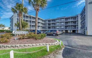 A multi-story hotel with a sign reading "Ocean Cove."