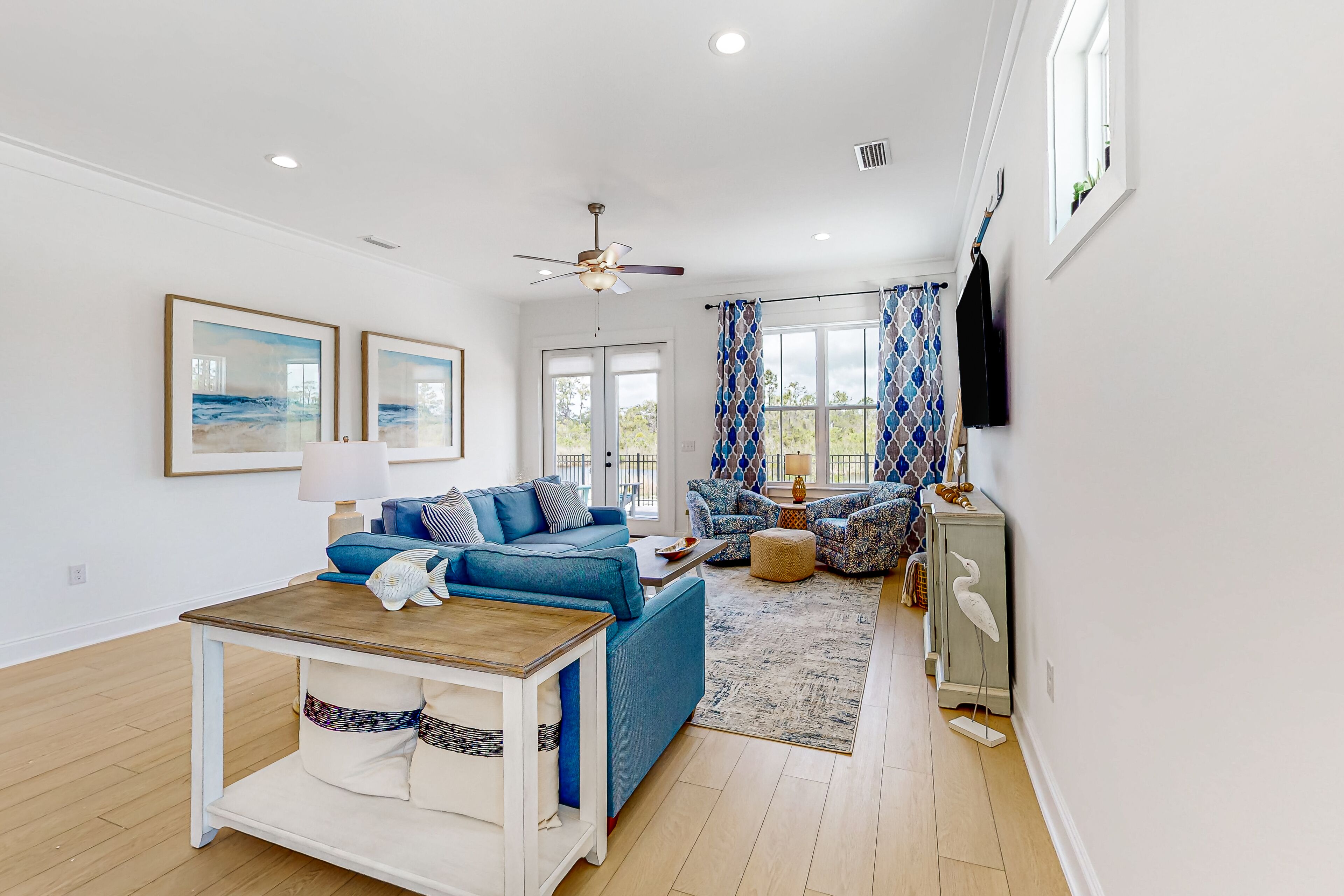 Water-view home with pool, arcade games, grill, balcony, streaming, W/D