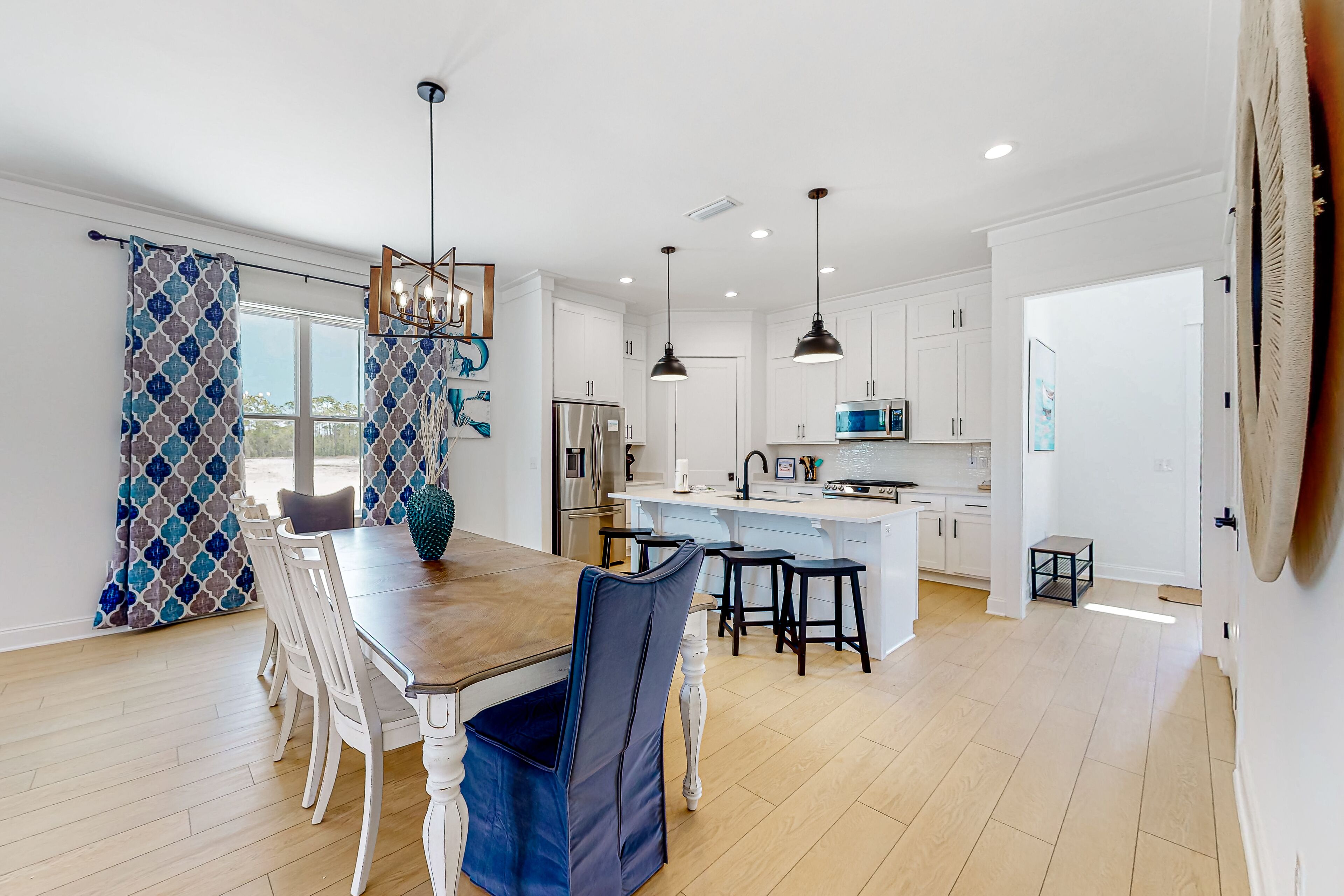 Water-view home with pool, arcade games, grill, balcony, streaming, W/D