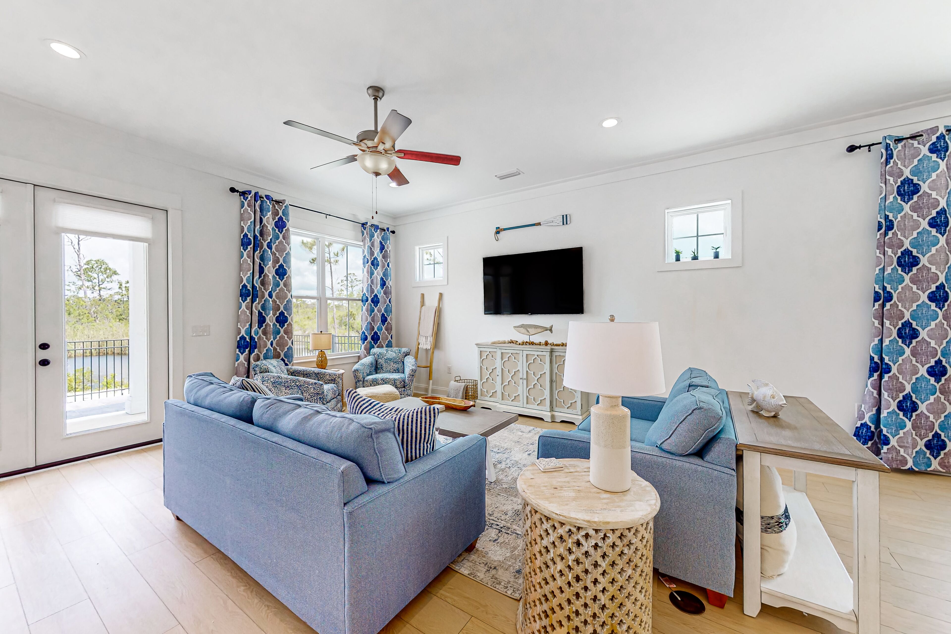 Water-view home with pool, arcade games, grill, balcony, streaming, W/D