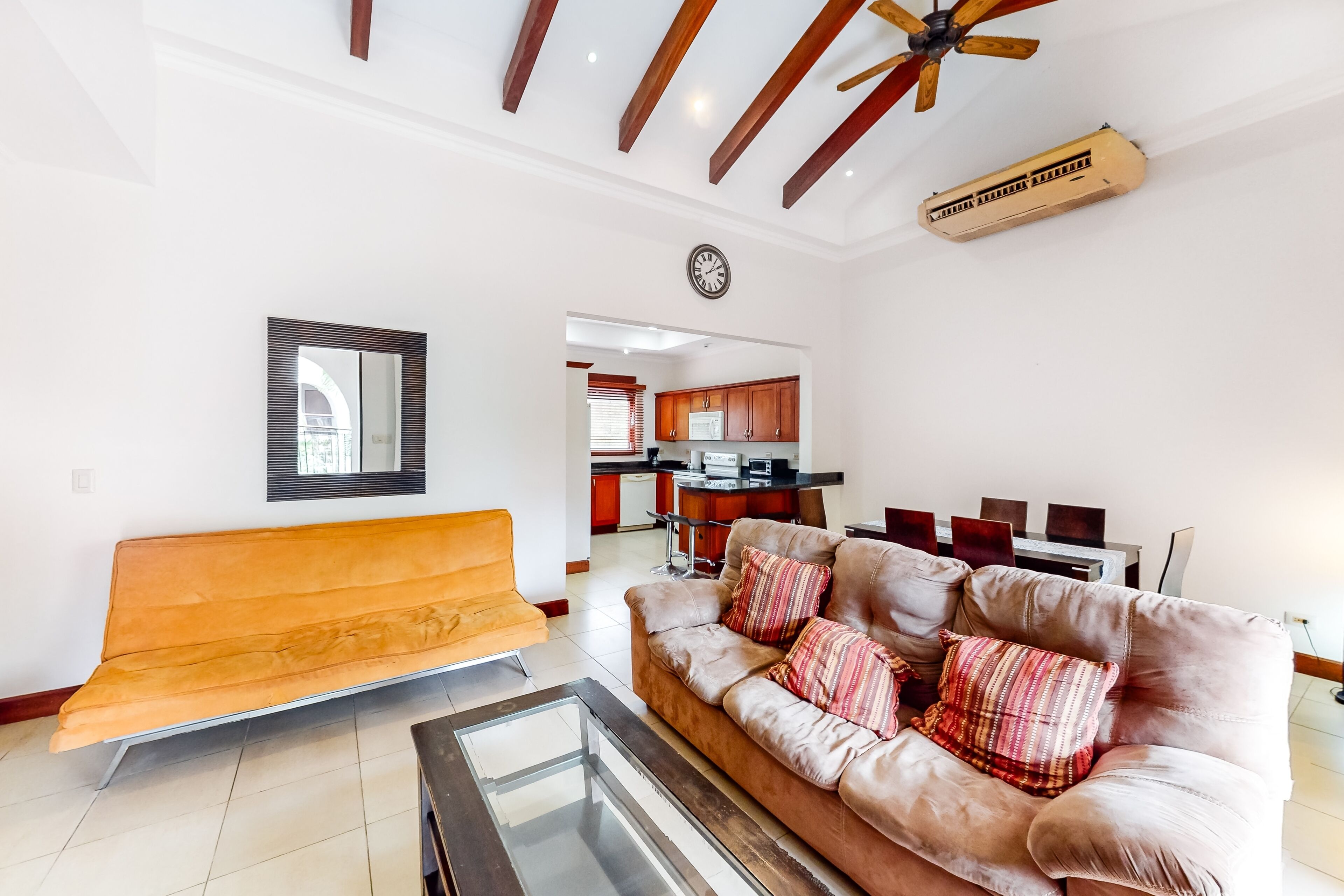 Tropical condo near the beach with shared pool, balcony, & W/D