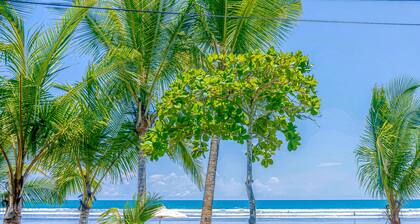 Tropical condo near the beach with shared pool, balcony, & W/D