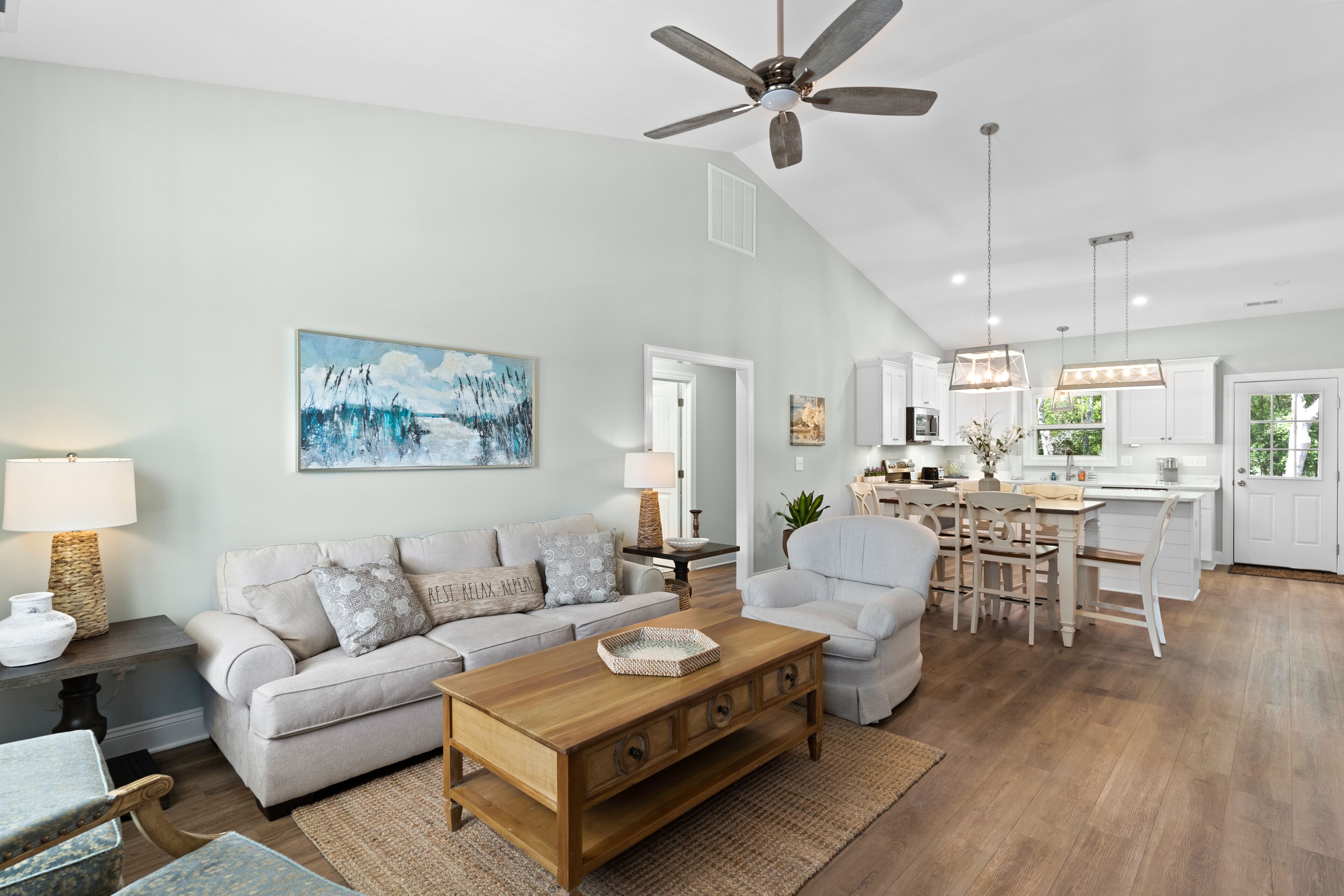 Upper-level coastal home close to town with grill, screened porch, deck, & W/D