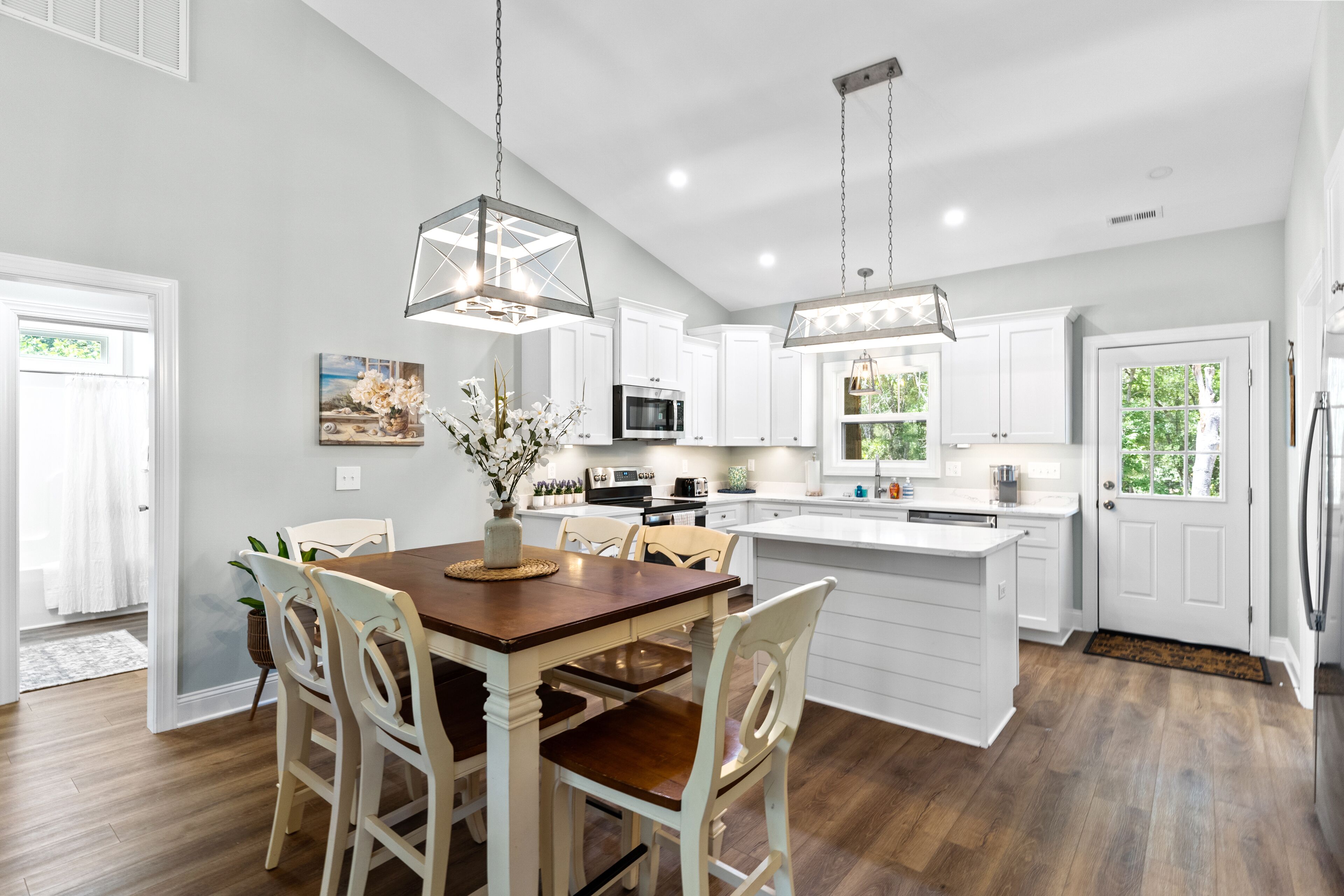 Upper-level coastal home close to town with grill, screened porch, deck, & W/D