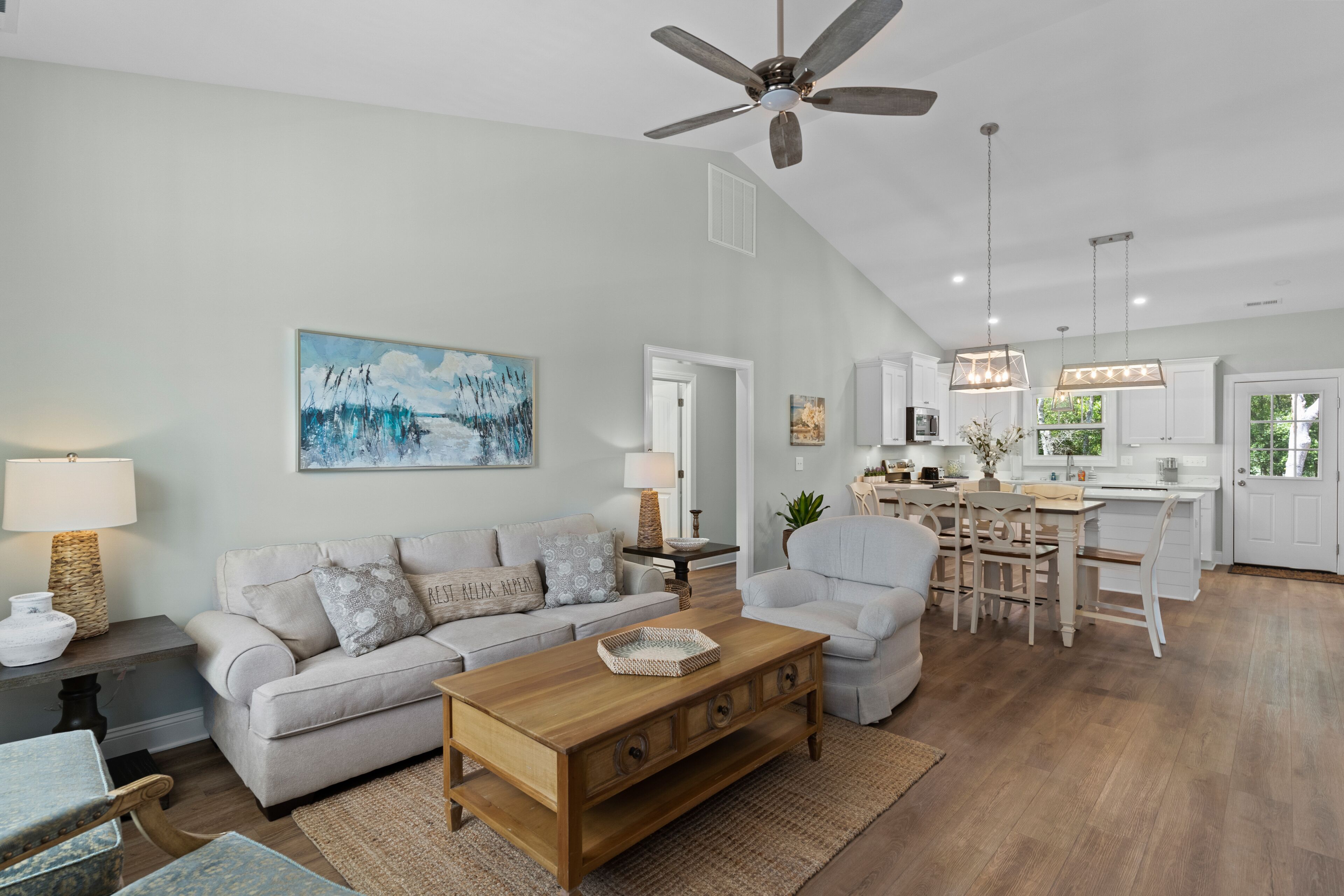 2-story coastal home with 2 grills, screened porch, outdoor showers, W/Ds, & AC