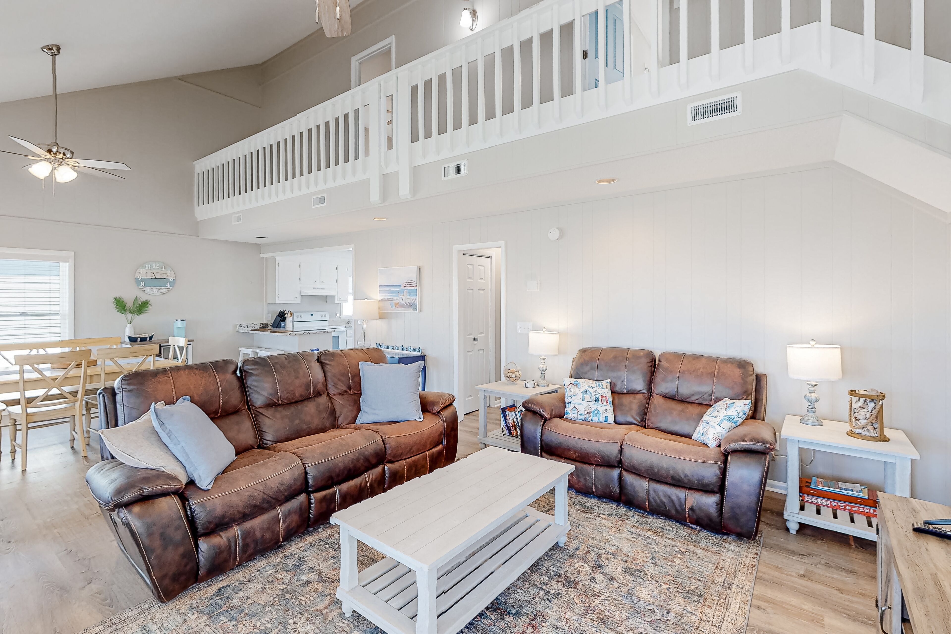 Canal-front dog-friendly home with beach views, dock, balconies, & beach access