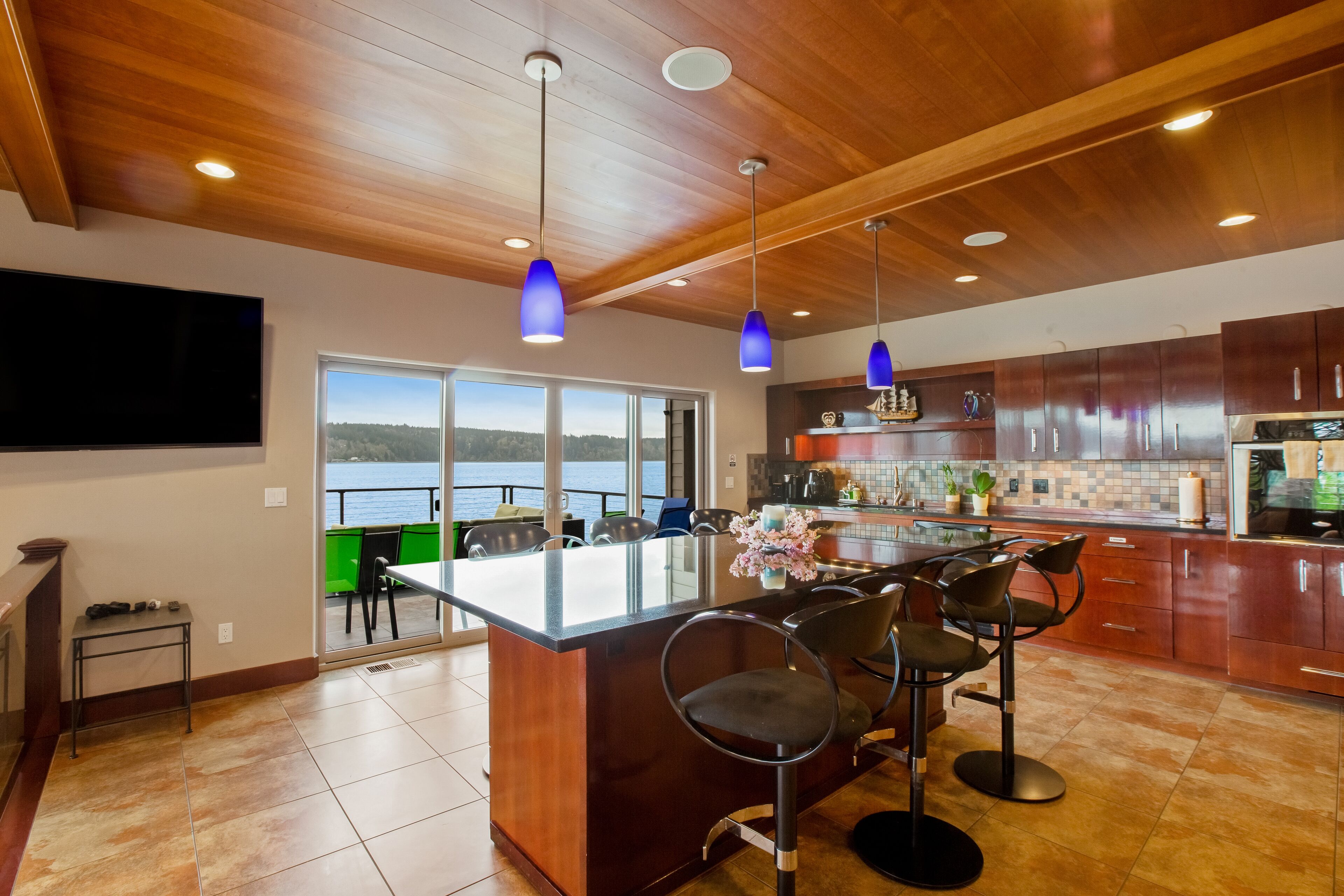 Inviting waterfront home with kayaks, dock, firepit, central AC, & W/D