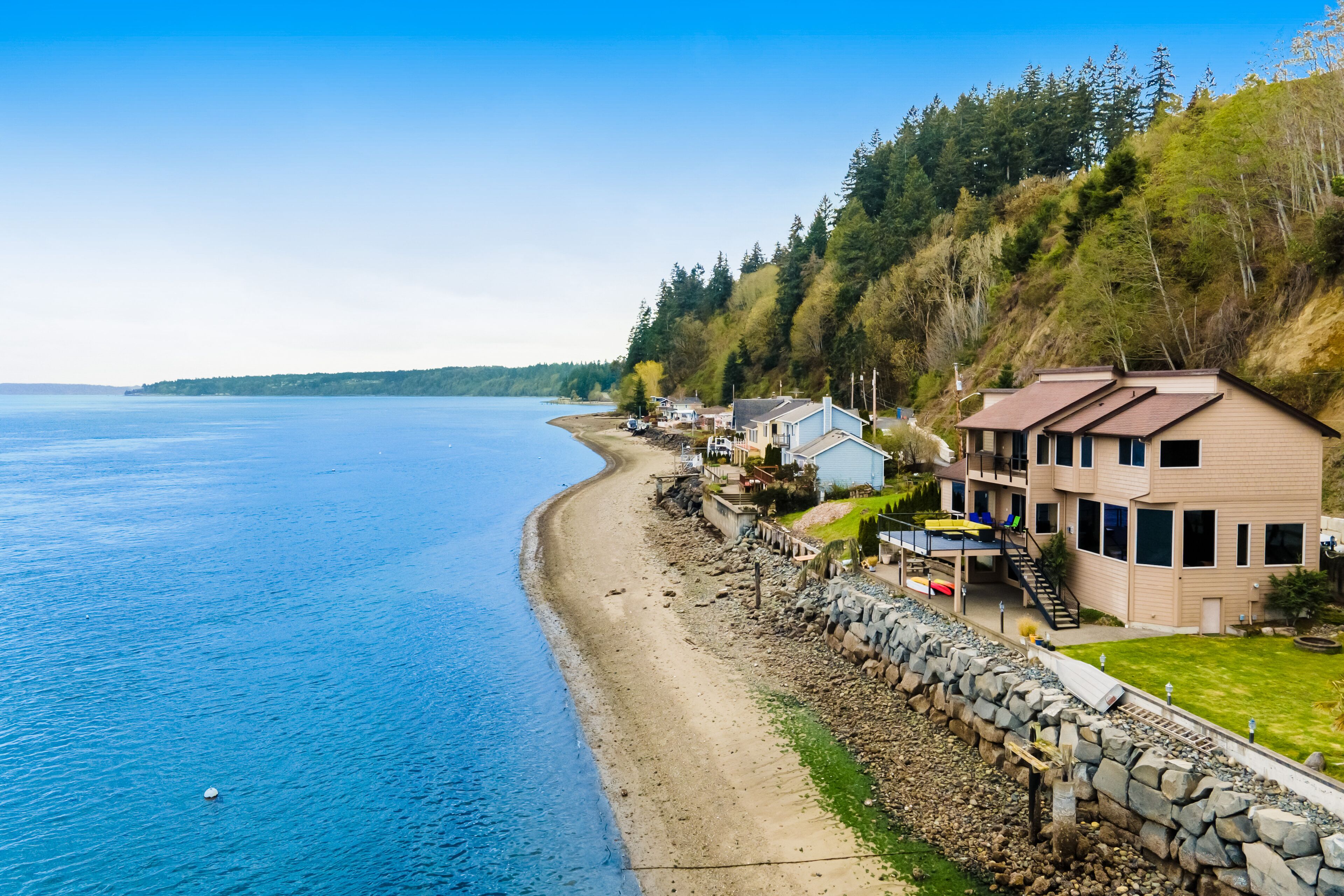 Inviting waterfront home with kayaks, dock, firepit, central AC, & W/D