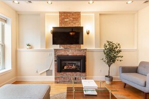 TV, fireplace, books