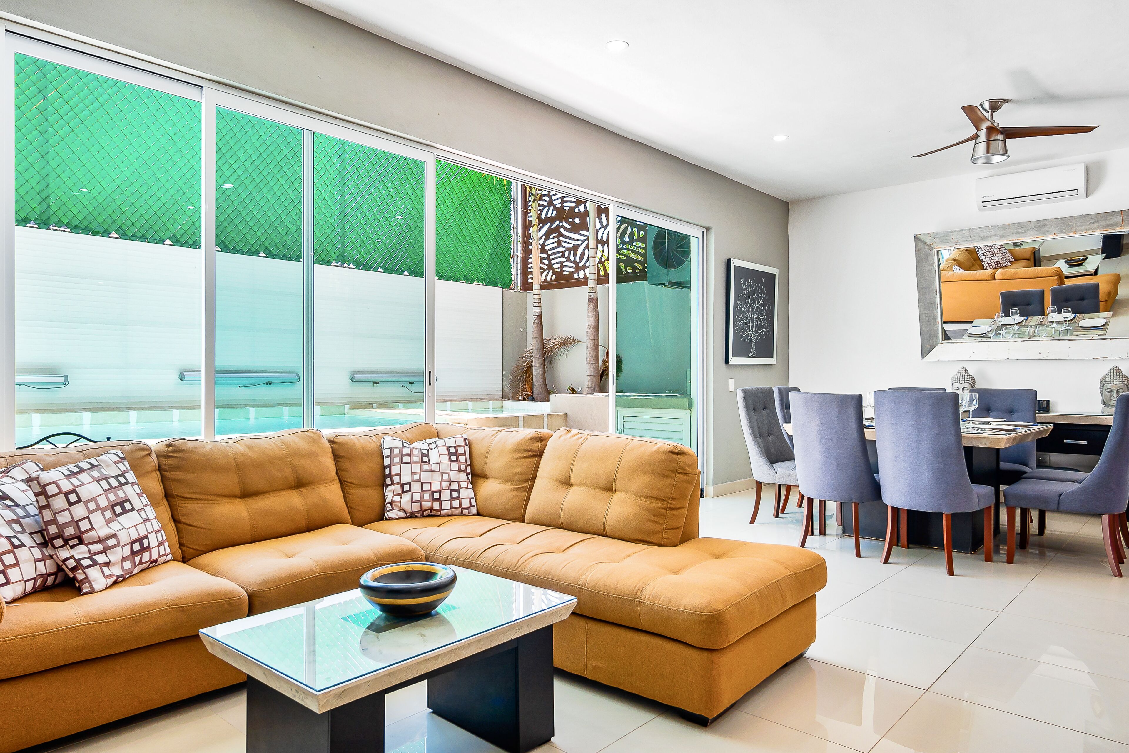 Dazzling estate with a pool, rooftop balcony, four-bedrooms, washer/dryer, & AC