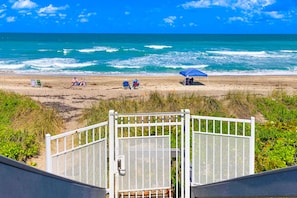 Relax on the beach with ocean views and comfortable seating.