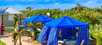 Beachfront condo with ocean views, pool, sundeck, & private balcony