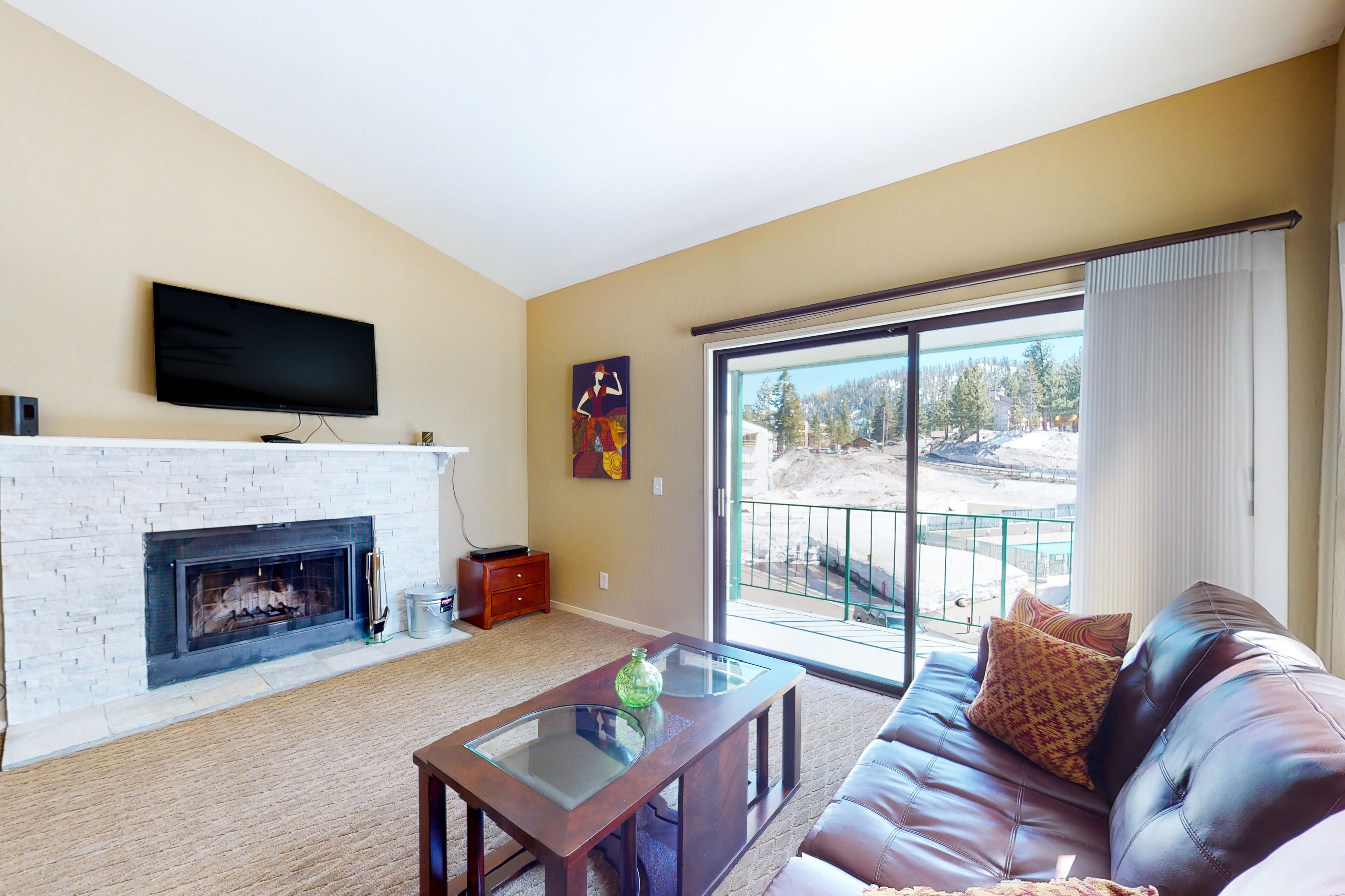Mountain-view condo with pool and hot tub access - balcony and fireplace
