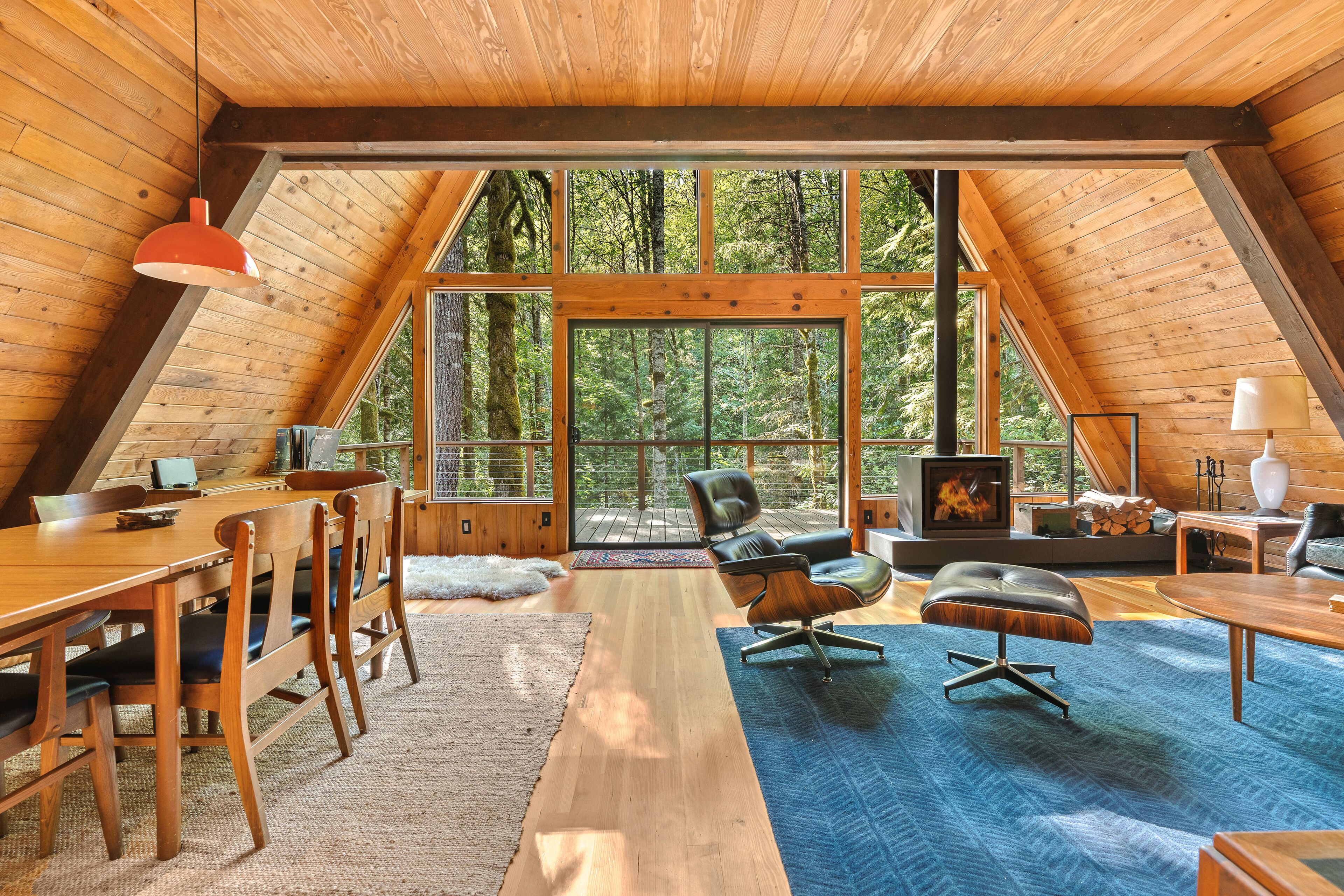 Riverside A-frame in gated cabin community with private deck, woodstove, & W/D