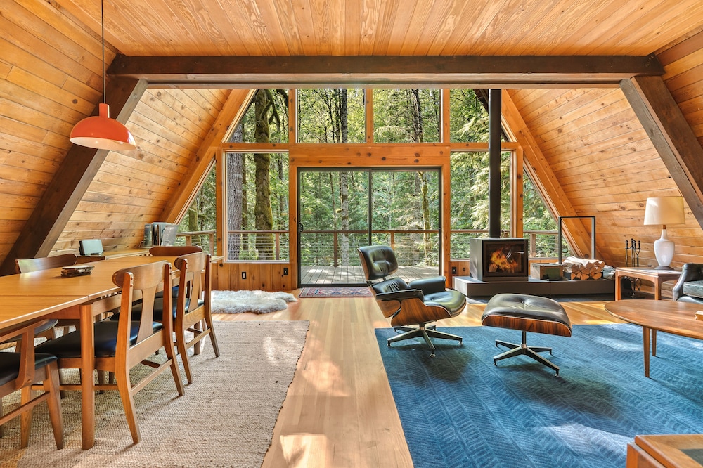Riverside A-frame in gated cabin community with private deck, woodstove, & W/D