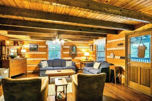 TV, fireplace - Cozy Authentic Log Cabin One Bedroom with Loft Bedroom One & a Half Bath Wi-Fi (Townsend)