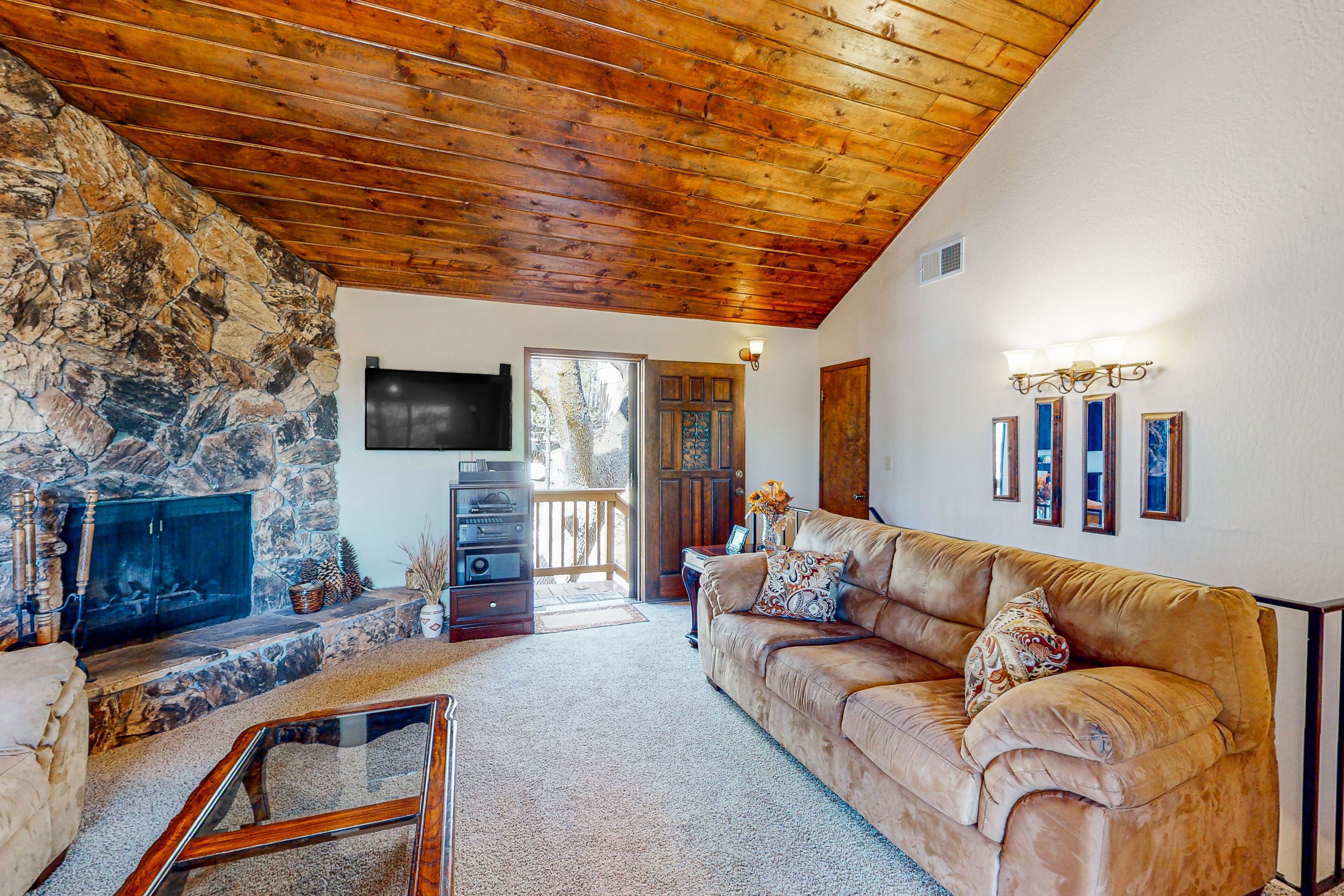 Wilderness retreat with a wood-burning fireplace, grill, deck, and washer/dryer