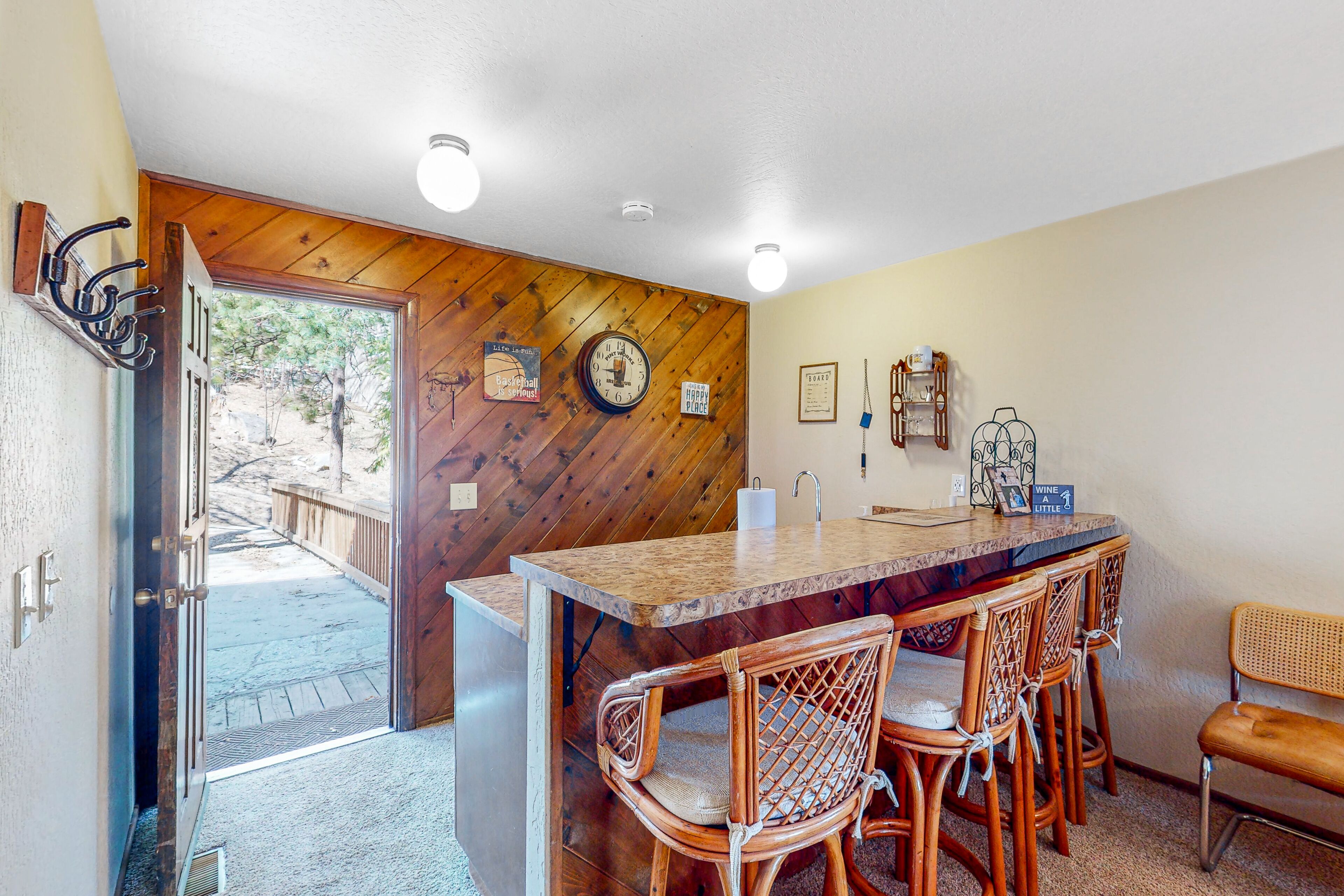 Wilderness retreat with a wood-burning fireplace, grill, deck, and washer/dryer