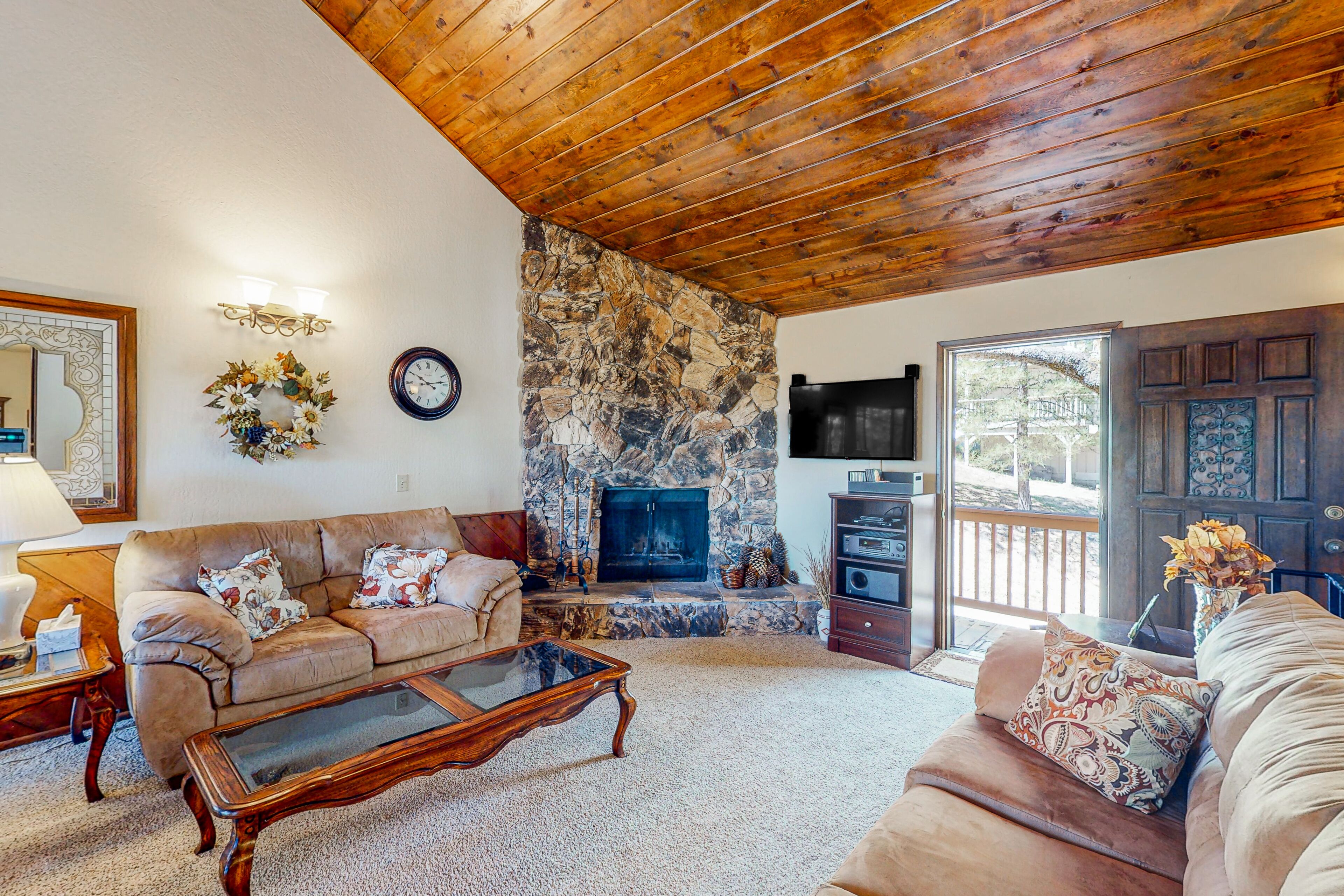 Wilderness retreat with a wood-burning fireplace, grill, deck, and washer/dryer