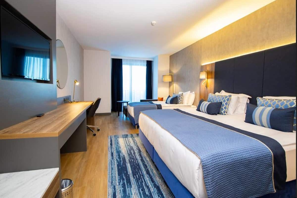 Deluxe kamer | Luxe beddengoed, Tempur Pedic-bedden, een minibar, een kluis op de kamer