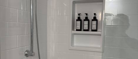 Shower, hair dryer, towels, soap