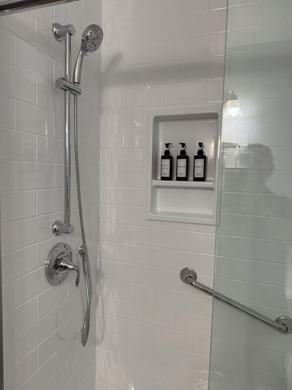 Shower, hair dryer, towels, soap