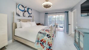 A bedroom with a bed, a ceiling fan, a window with curtains, and a door. - MODERN HOME WITH HEATED POOL! CLOSE TO SAWGRASS MILLS MALL! FLEXIBLE CHECK IN 
  (Sunrise)
